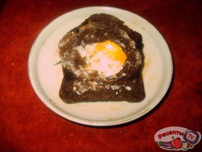 Fry egg in a black bread.     .